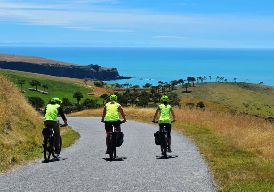 Akaroa: Guided Electric Mountain Bike Tour-Lava Loop - Riding from Akaroa toward the crater rim