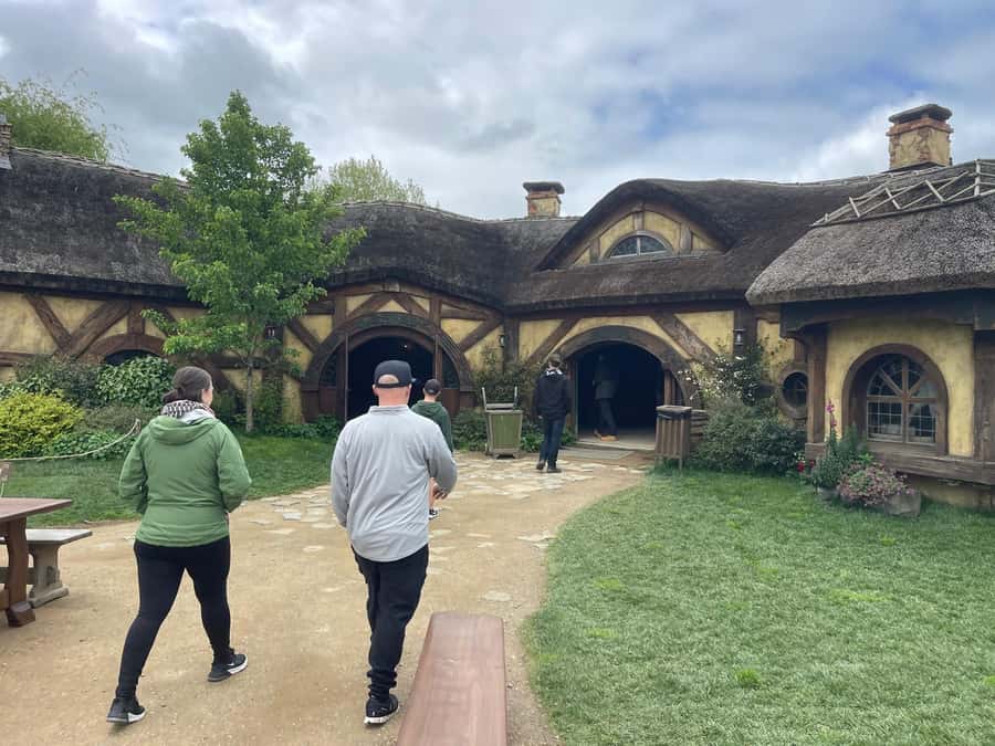 From Auckland: Hobbiton Movie Set and Waitomo Caves Tour - Walking through 44 hobbit holes