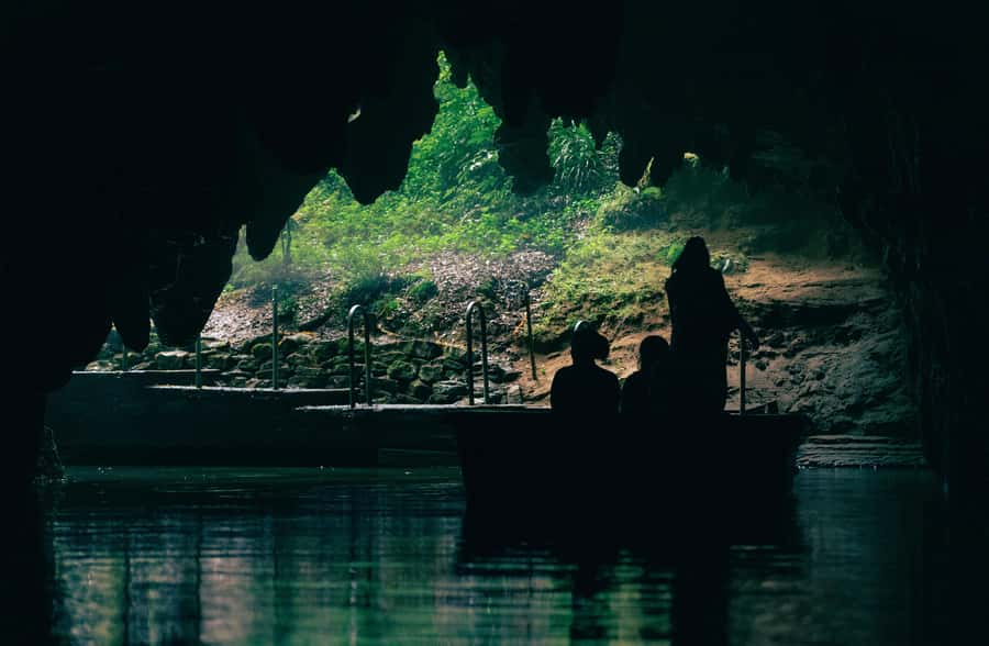 From Auckland: Rotorua Māori Village, Haka & Glowworm Caves - The glowworm boat ride at Waitomo