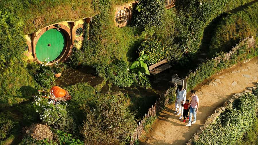 From Rotorua: Hobbiton Movie Set Tour with Festive Lunch - Walking through 12 acres of Hobbiton