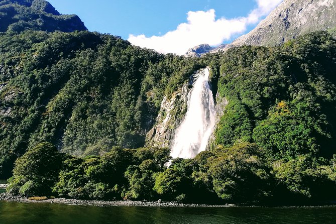 Luxury Milford Sound Coach and Scenic Cruise - Homer Tunnel shows the road’s engineering challenge