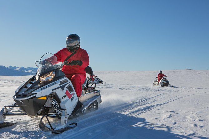 Queenstown Heli-Snowmobiling Adventure - Riding your own snowmobile across remote high country