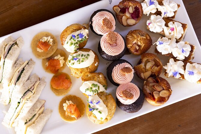 Queenstown Lake Cruise and Walter Peak Farm Adventure - Afternoon tea with lake and garden views