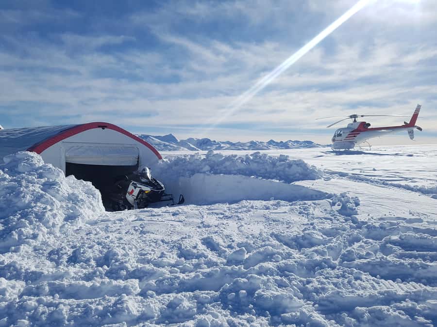 Queenstown: Snowmobiling Experience with Helicopter Flight - Riding across the snowy plateau