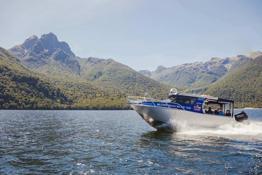 Self-Guided Milford Track Day Walk from Lake Te Anau - Crossing the Clinton River swing bridge
