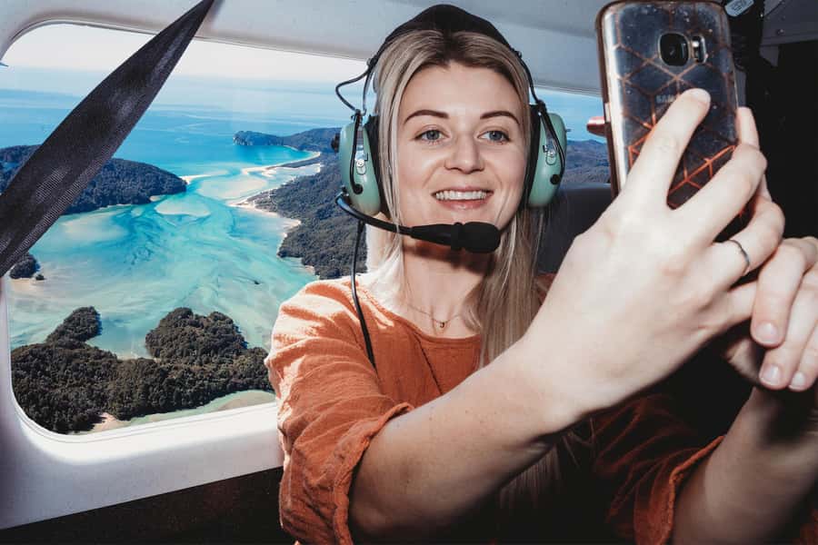 Takaka: Farewell Spit/Abel Tasman Scenic Flight - Taking photographs from the aircraft