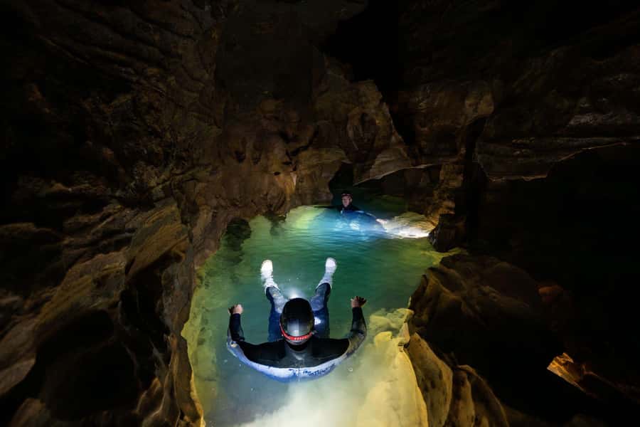 The Waitomo Experience : Okohua Glowworm Cave Tour - Walking across farmland to the cave entrance