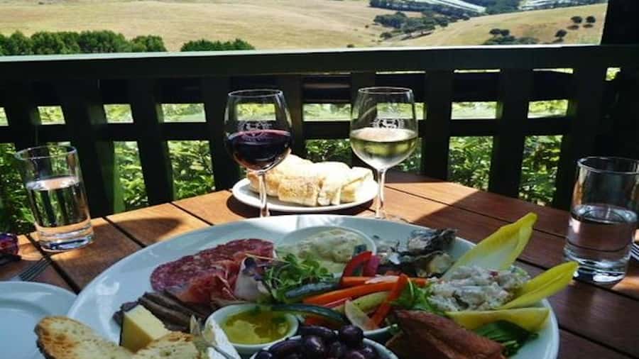 Waiheke: Scenic Taste and Graze Tour with Wine, Whisky, Beer - Mudbrick Vineyard and the first look across the gulf