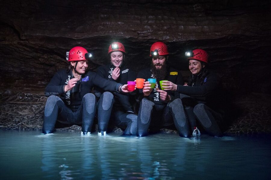 Waitomo Caves Black Abyss Ultimate Caving Experience - Black-water rafting, floating, and cold underground pools