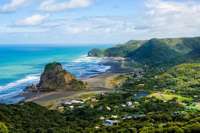 West Coast Discovery Tour - Piha Beach, black sand, surf, and Lion Rock